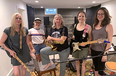 The Maneaters, left-to-right: Barb Brynstad, Alyse Emanuel, Sue Orfield, Jenny Case, and Maureen McFarlane.
