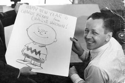 Charles Schulz, right, his drawing of the Charlie Brown character