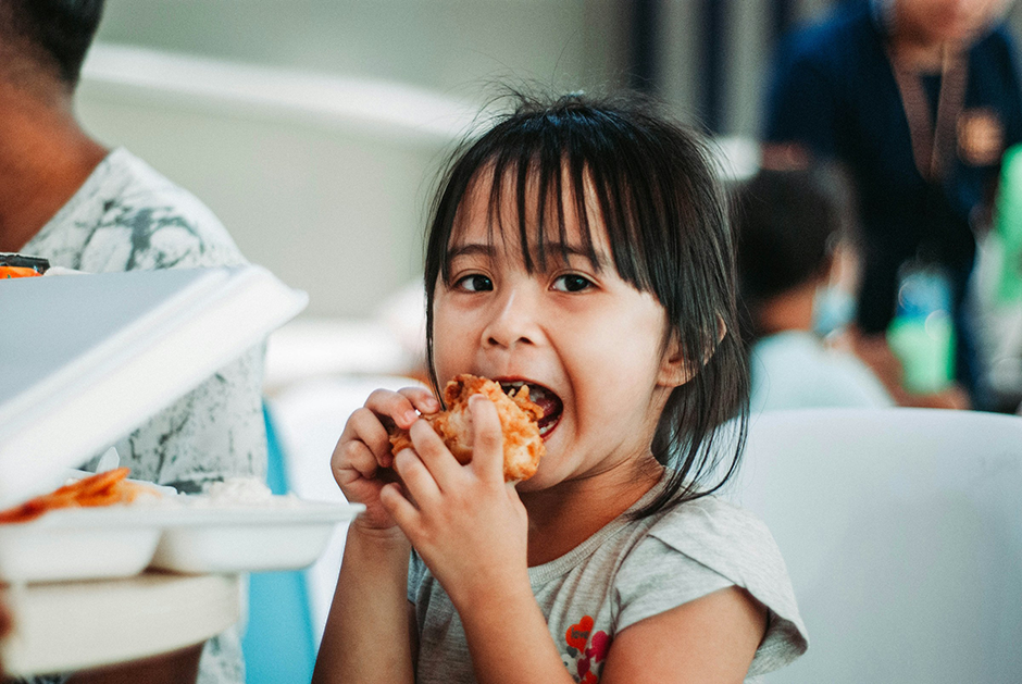 Child eating a school lunch.