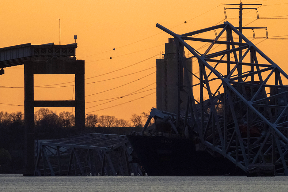 The sun setting Thursday evening on the wreckage of the Francis Scott Key Bridge in Baltimore, Maryland.