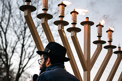 Rabbi Didy Waks from Chabad speaking during the annual Menorah Lighting