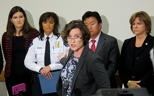 Mayor Betsy Hodges, center, asking for a civil rights investigation