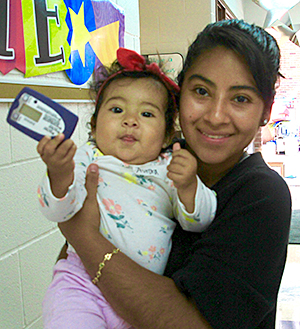 Nadia Barrientos holding her 10-month-old daughter.