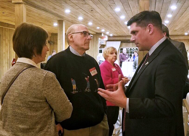 U.S. Senate candidate Kevin Nicholson, right, speaking with potential voters.