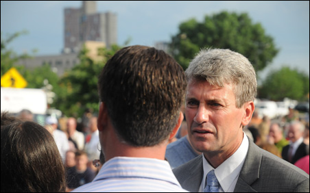 Minneapolis Mayor R.T. Rybak speaks with event attendees after the Remembrance Garden opening.
