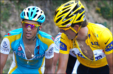Saxo Bank team rider Andy Schleck, right, of Luxembourg looks at Astana team rider Alberto Contador, left, of Spain as they climb the Port de Bales pass during the 15th stage of the Tour de France on Monday.