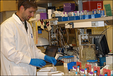 Minnesota Partnership for Biotechnology and Medical Genomics lab technician Tony Bilyeu works on blood samples for genomic studies.