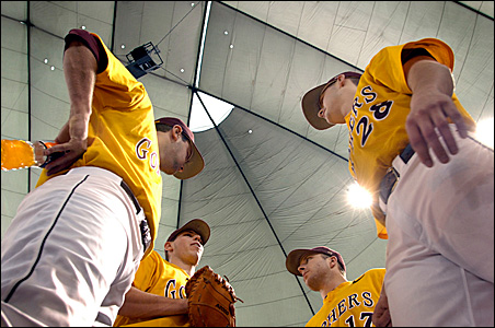 Gopher players confer Sunday during their 11-9 victory over Northern Iowa at the Metrodome.