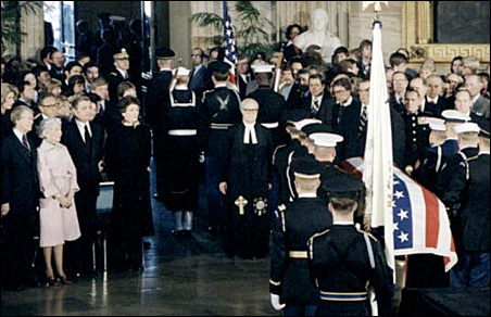 President Jimmy Carter, Muriel Humphrey, Vice President Walter Mondale and Joan Mondale view the procession of Hubert Humphrey's coffin out of the Capitol rotunda.