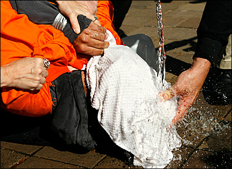 Demonstrator Maboud Ebrahimzadeh is held down during a simulation of waterboarding outside the Justice Department in Washington, D.C., in 2007.