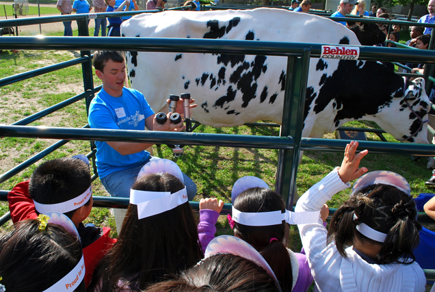 Matt Huot shows our kids how to milk a cow